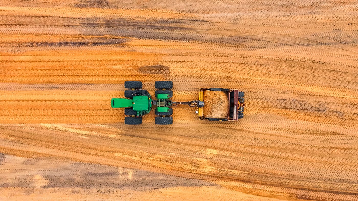 Top-down aerial of the GPS scraper working